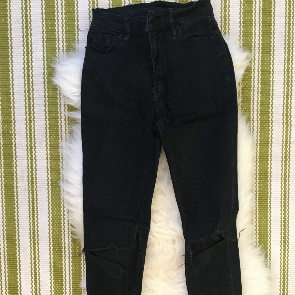 Black ripped jeans with holes at knees
